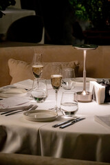 Glasses with wine in row background at restaurant party