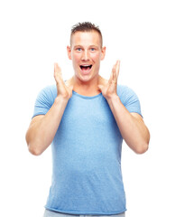 Portrait, man and shock for surprise, good news and announcement in studio on white background. Excited, happy and male person with smile for hearing, wow, and amazing story, gossip and scoop