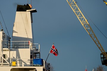 Fototapeta premium Norway flag on the stern of the ship. Norwegian ship in port.