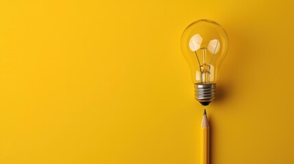 a yellow light bulb with a pencil sticking out of it on a yellow background with a shadow of a pencil. - obrazy, fototapety, plakaty