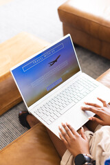 A person is browsing a travel website on a laptop