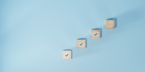 checkbox on wooden block cube to update work task progressive for project develop management...