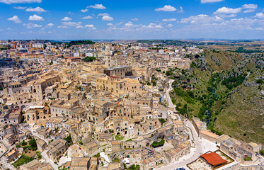 Fototapeta na wymiar Matera, Italy. City in the Italian region of Basilicata, the administrative center of the province of Matera. The old part of the city is carved out of the rock and is a UNESCO. Aerial view