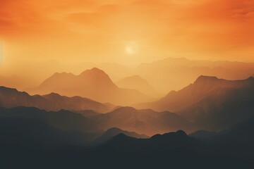 Misty mountains at sunset: High definition Phone wallpaper with warm orange and yellow tones