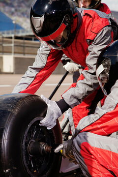 Pit crew in action during a race. 