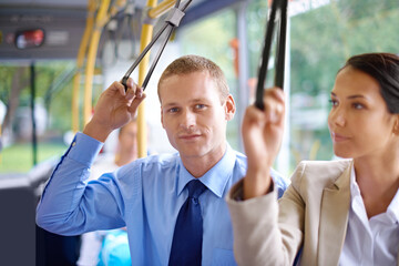 Portrait, public transport and business man on bus for morning commute to work for start of career or job. Travel, work and young passenger riding metro with colleague in city for trip or transit