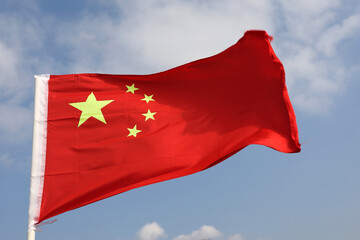 Flag of China on blue sky background