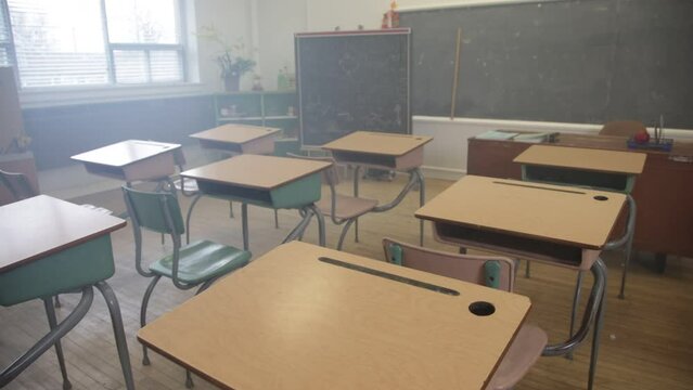 Empty classroom steady shot walking through desks