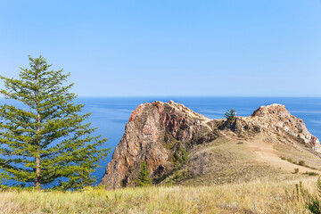 Baikal Lake in summer. Famous Cape Shunte Left or as it is also called Cape of Love - natural landmark of Olkhon Island. Beautiful summer landscape. Natural background. Travel and outdoor recreation