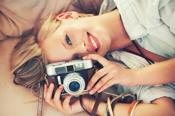 Portrait, woman and lens for retro, fashion and casual outfit for weekend getaway in Canada. Smile,...
