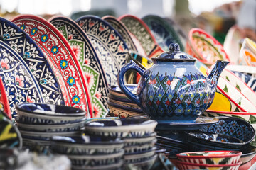 Multi-colored ceramic products with oriental ornaments at the Siab Bazaar in the ancient city of...