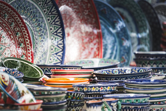 Multi-colored ceramic products with oriental ornaments at the Siab Bazaar in the ancient city of Samarkand in Uzbekistan, Siyob bozor