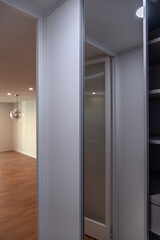 The cabinet at the entrance corridor in the renovated apartment