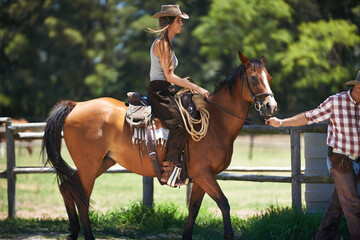 Female woman, horse and farm with cowboy, stable and ranch in Texas for pony riding. Stallion, mare...