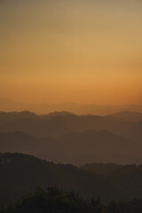 landscape and travel concept with sunset and twilight sky with layer of mountain
