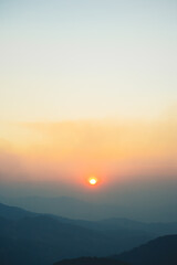 landscape and travel concept with sunset and twilight sky with layer of mountain