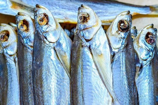 Dried sabrefish in selective focus. Sale of fresh tasty fish in a store or market.