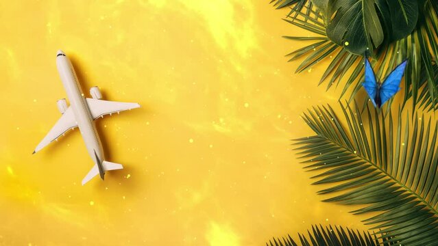 top view of traveler accessories tropical palm leaf on yellow background. seamless looping overlay 4k virtual video animation background