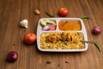 Paneer tikka biryani with onion raitha, vegetable biryani, hyderabadi biryani, south indian biryani served in plate