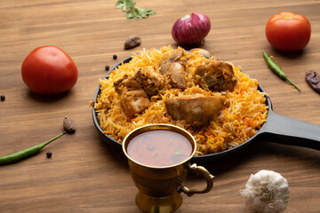 Restaurant style Spicy Chicken Biryani served with Raita and Salan, Popular Indian or Pakistani non vegetarian Food
