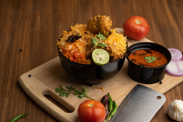 Restaurant style Spicy Chicken Biryani served with Raita and Salan, Popular Indian or Pakistani non...