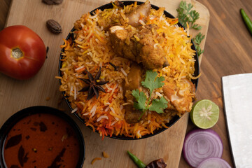 Restaurant style Spicy Chicken Biryani served with Raita and Salan, Popular Indian or Pakistani non...