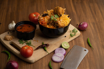 Restaurant style Spicy Chicken Biryani served with Raita and Salan, Popular Indian or Pakistani non...