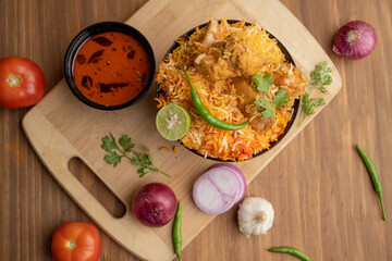 Restaurant style Spicy Chicken Biryani served with Raita and Salan, Popular Indian or Pakistani non vegetarian Food