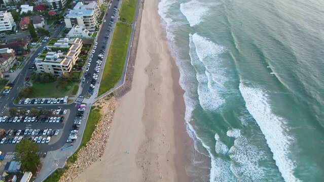 Aerial drone view above Cronulla in the Sutherland Shire, South Sydney, NSW Australia looking down at Prince Street and the beach during an early morning sunrise in February 2024   