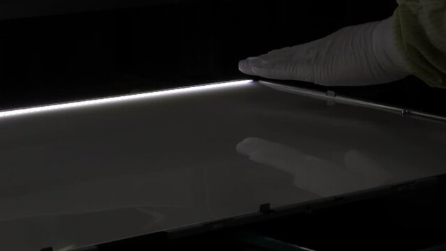 Electronics production lines in modern factories. TV back light unit manufacturing technology