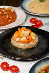 Appetizer varieties. Traditional Turkish and Arabic delicacies. Various mezze flavors on white wood background. Dolma, Muhammara, artichoke with olive oil, kibbeh, chicken salad, eggplant salad