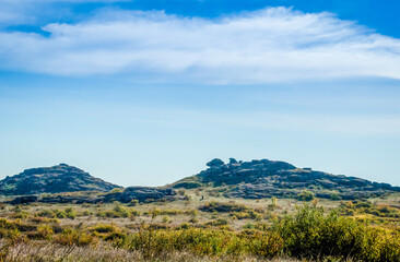 stone mountains and.blue sky with white clouds