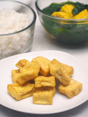 Delicious fried White tofu serve in white plate