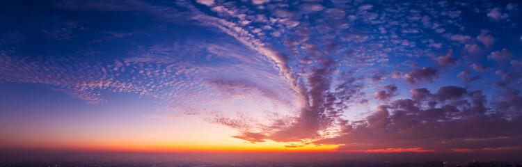 Aerial view of spectacular sky clouds nature landscape at sunset. The purple sky clouds are like a...