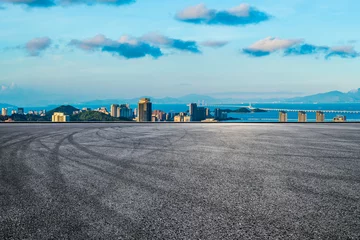 Foto auf Acrylglas Antireflex Asphalt road square and beautiful coastline with modern buildings at sunset in Zhuhai. High angle view. © ABCDstock