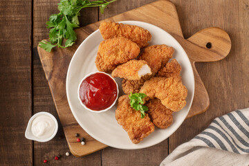 Chicken strips with tomato ketchup and mayonnaise