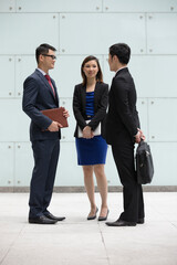 Asian Business colleagues talking