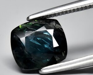 natural blue sapphire gem on the background