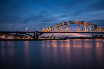 Fototapeta na wymiar Waalbridge in Nijmegen, the Netherlands over the river Waal at sunset.