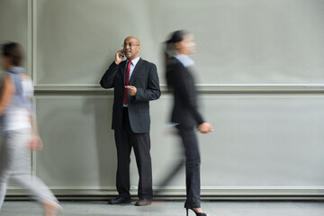Chinese Business man using a Cell Phone.