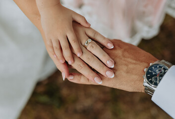 bride and groom holding hands