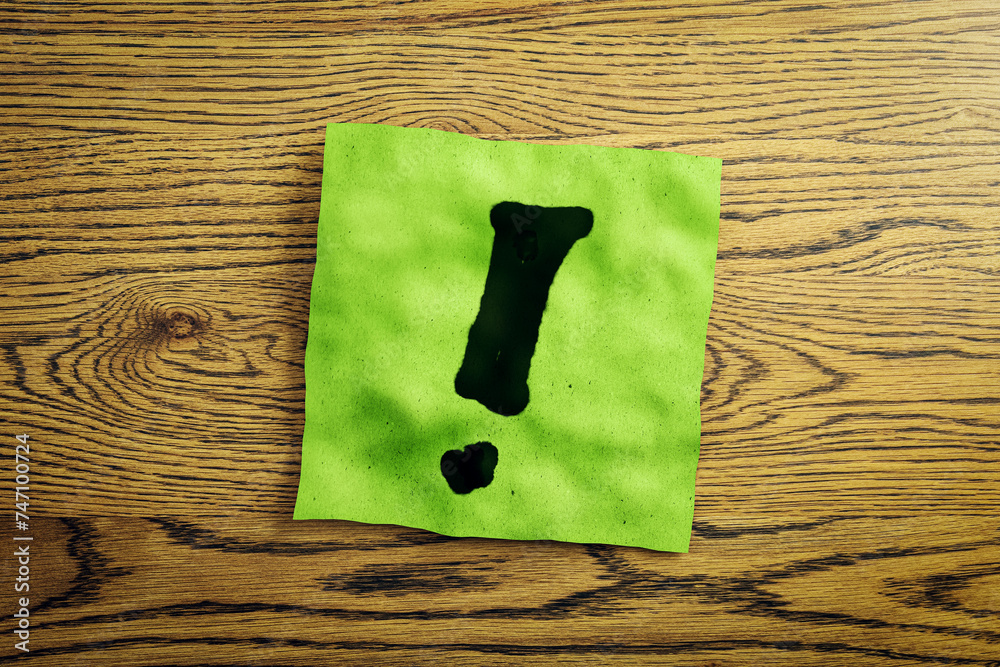 Poster Close up of green note paper with exclamation mark on wooden desk. Questions and answers concept. 3D Rendering.