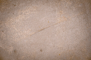 The brown concrete floor is rough and stained.