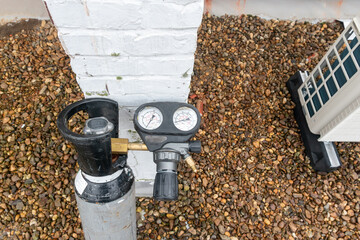 Nitrogen cylinder, pressure reducing nitrogen, pressure gauge with nitrogen cylinder for refilling air conditioning - obrazy, fototapety, plakaty