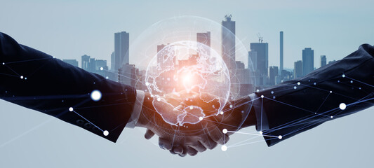 Mixed media of group of people shaking hands and global communication network concept. Worldwide business. Marketing. Wide angle visual for banners or advertisements.