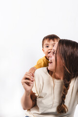 Portrait of a mother with her son smiling on white background
