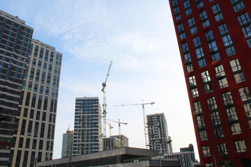 Fototapeta na wymiar construction site with tall buildings and construction cranes