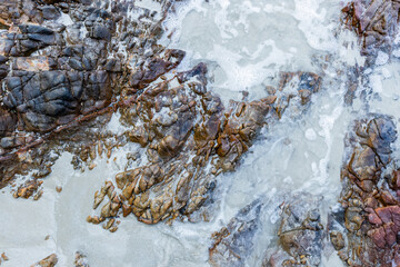 Stones on the sandy beach. There is space for entering text.