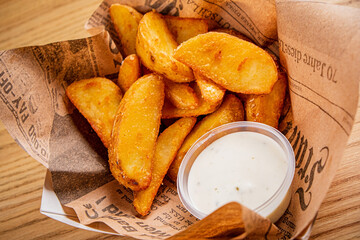 baked potato with sauce on parchment
