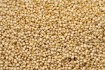 Dry quinoa uncooked closeup texture. Healthy eating